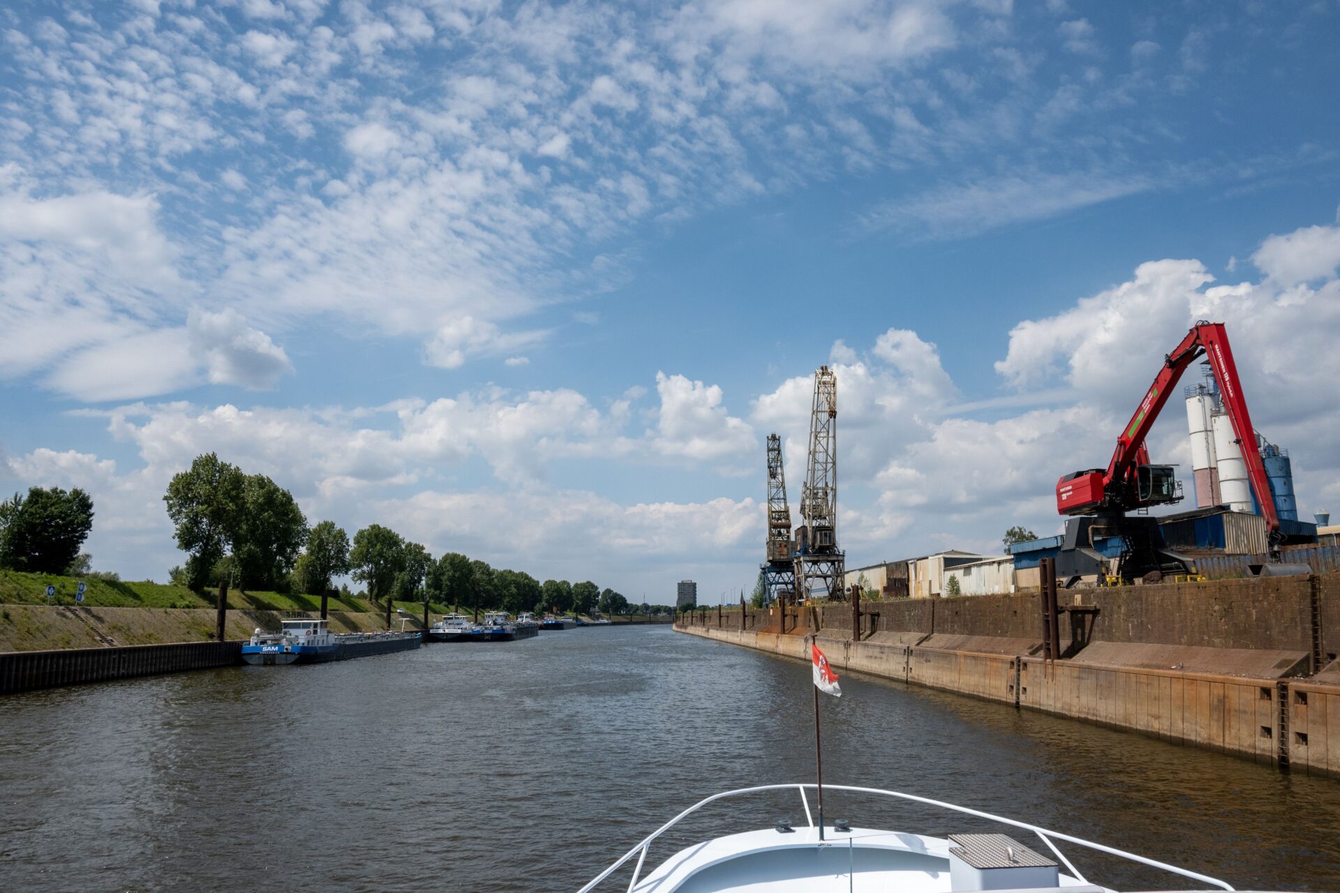 Ship on the Rhine, cranes on the right