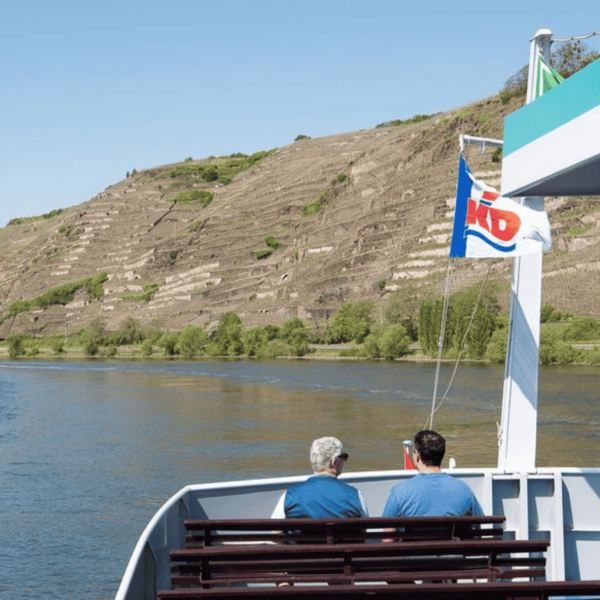 MS Goethe on the Middle Rhine. Two men are sitting on a bench at the stern - you can see their backs