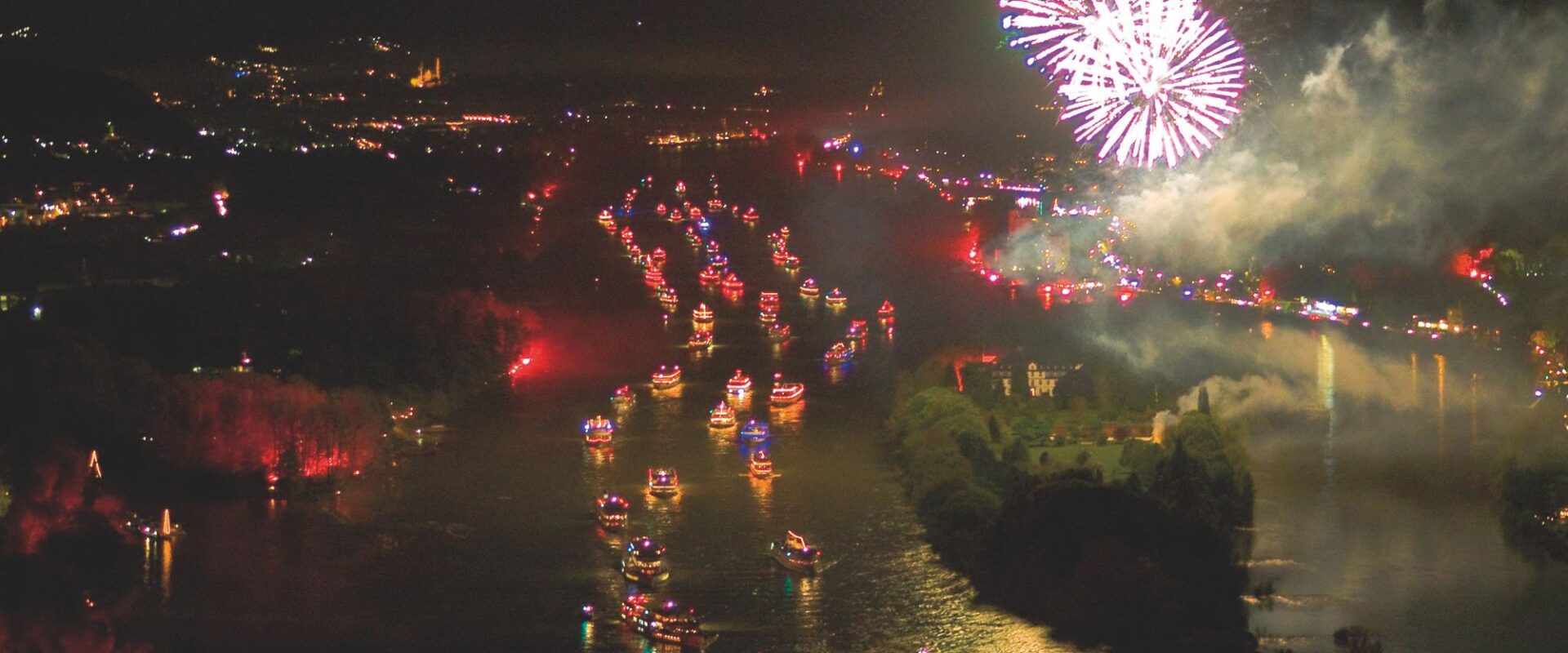 Many ships on the Rhine, fireworks in the sky