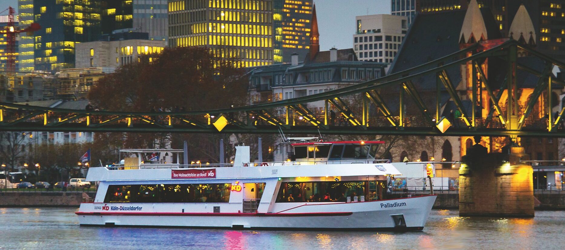 MS Palladium against the backdrop of Frankfurt in the evening