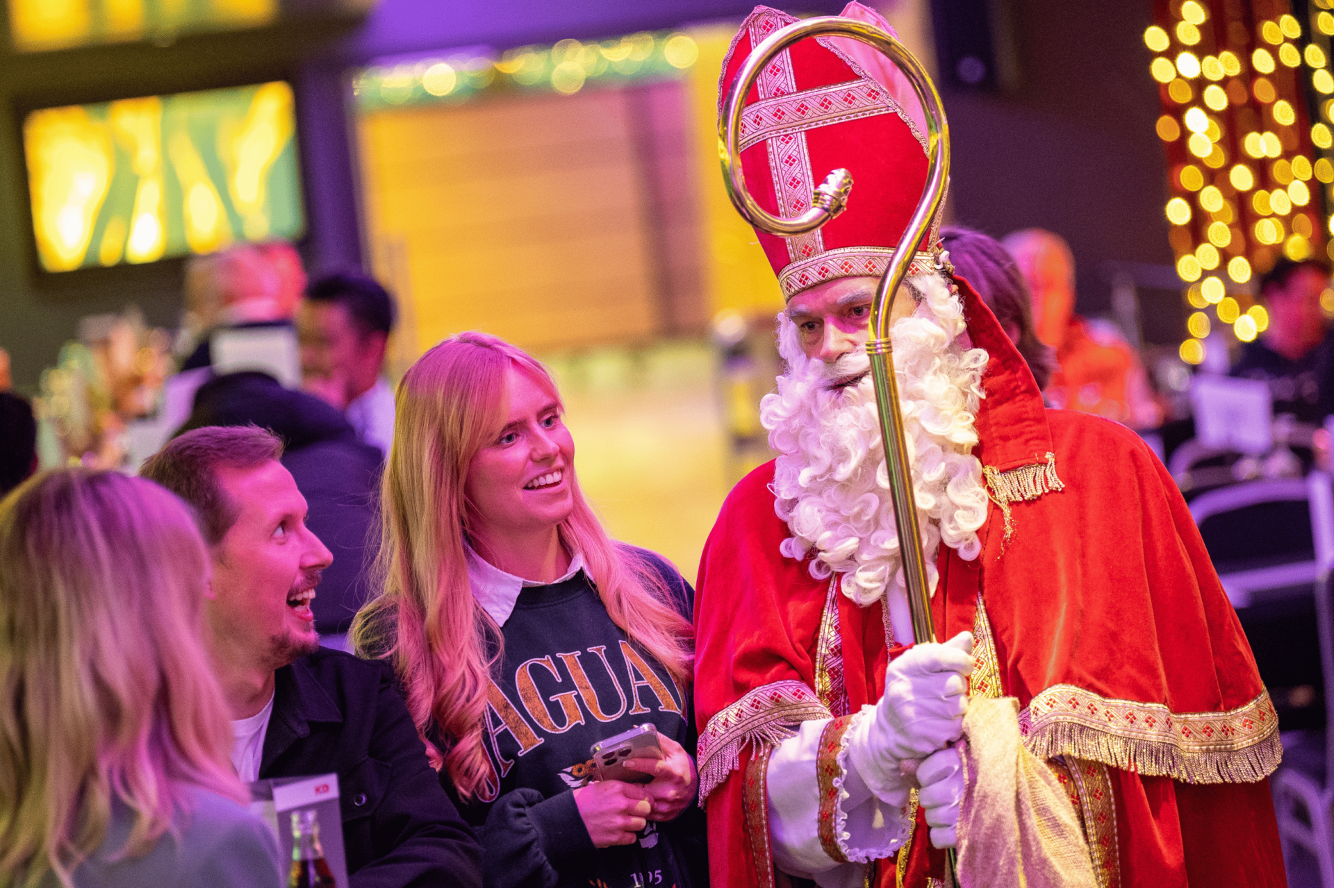 Three people talk to Santa Claus on board