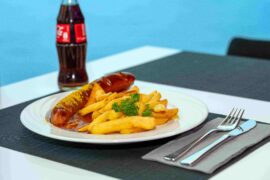 French fries with currywurst and cola